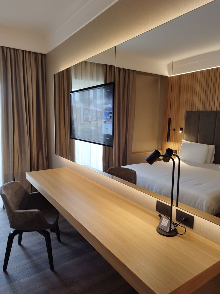 Suite corner with minimalist furnishings and comfortable bedding